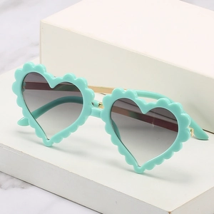 Fashionable heart-shaped children sunglasses with mint green frame and metal temples