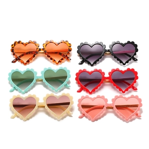 Set of six heart-shaped kids sunglasses with scalloped edges in various vibrant colors