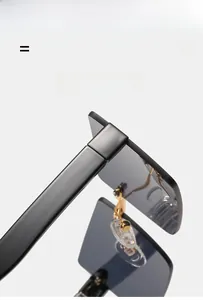 Detail shot of square sunglasses showing the flexible metal hinge and black frame texture