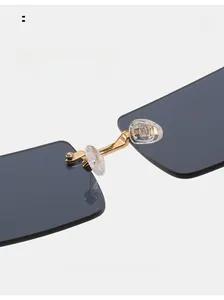 Macro shot of gold metal nose bridge and soft silicone pads on square sunglasses