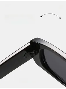 Macro detail of a durable metal hinge on sleek black square-frame children's sunglasses