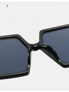 Detailed close-up of integrated nose pads on black oversized fashion sunglasses