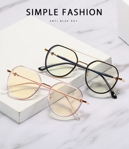 Detail of anti-blue light glasses with metal TR90 frames and decorative gear hinges