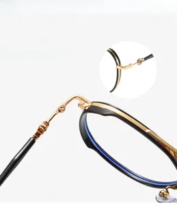 Detail of the durable metal hinge and black gold TR90 frame with mortise temples