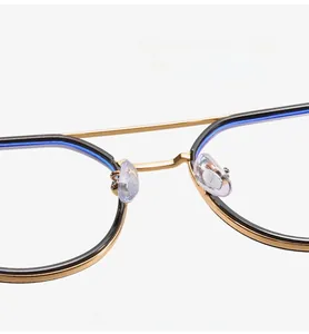 Macro detail of TR90 metal mixed glasses frame with gold nose bridge and silicone pads