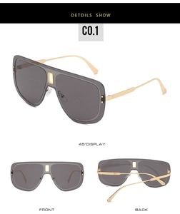 Vues détaillées de lunettes de soleil oversize avec verres fumés et branches dorées