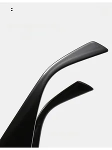 Macro detail of curved black sunglasses legs with an ergonomic arc design for comfort