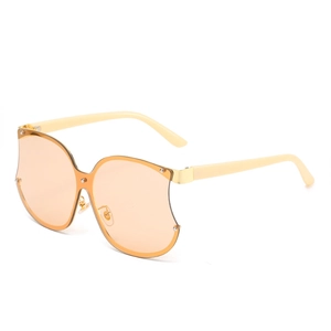 Lunettes de soleil oversize en forme de pomme, verres ambre et branches de couleur crème