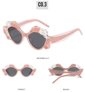 Three-way view of pink geometric sunglasses with gray lenses and crystal accents