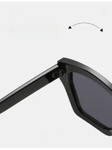 Detail of durable metal hinges and glossy black frame on square fashion sunglasses