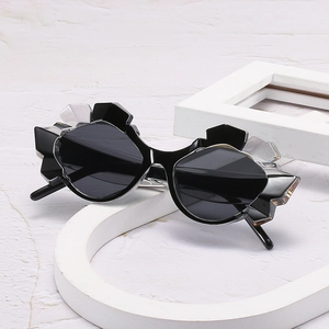 Chic black geometric polygonal sunglasses with dark round lenses in a minimalist style