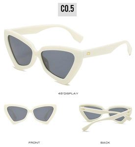 Detail of cream triangle cat-eye sunglasses with gray lenses and gold hinge accents