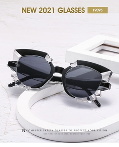 Detailed view of geometric polygon cat-eye sunglasses with transparent faceted frames
