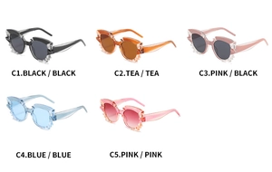 Detailed grid of five cat-eye sunglasses with distinct sawtooth temple frame designs
