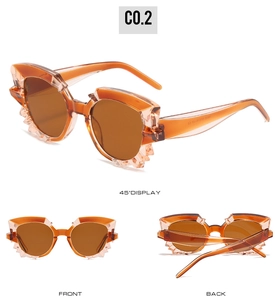 Detailed views of orange translucent geometric sunglasses with crystal cut facets