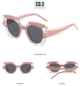 Detailed views of pink geometric cat-eye sunglasses with translucent crystal-cut frames