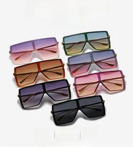 Flat lay of multi-color oversized square sunglasses with metallic temple accents