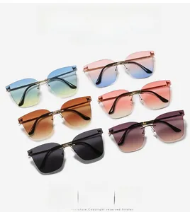 Six pairs of rimless oversized sunglasses with gradient lenses and slim gold metal frames