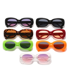 Retro oval sunglasses set in multiple colors including black, leopard, and neon frames