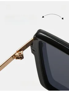 Macro shot of durable gold metal hinge on premium square black glossy sunglasses