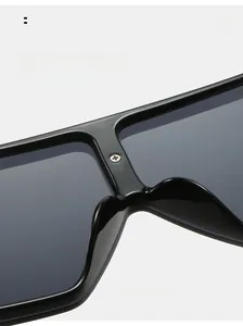 Detail of seamless integrated nose pads and metal screw craftsmanship on black sunglasses