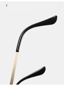 Detail of metal glasses temples with curved black tips for comfortable wearing