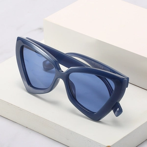 Modern jelly blue cat-eye sunglasses with geometric frames and blue tinted lenses