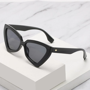 Modern black triangle cat-eye sunglasses for women with gold geometric accents