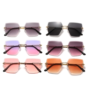 Frameless geometric sunglasses with gold metal structure and various gradient color lenses