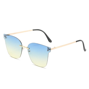 Fashionable rimless sunglasses with gold metal frame and blue-yellow gradient lenses