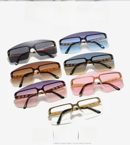Flat lay display of trendy oversized rimless sunglasses in seven stylish gradient colors