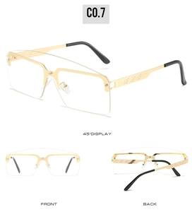 Detail view of gold metal sunglasses frame with horizontal striped hollow temples