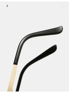Detail of curved black acetate earpieces and gold metal temples for comfortable wear