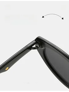 Macro detail showing durable metal hinge construction and reinforced screws of sunglasses