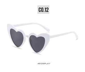 Detail view of heart-shaped sunglasses with white frame and dark lenses at a 45-degree angle