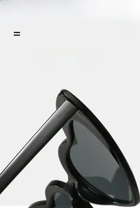 Close-up of heart-shaped black sunglasses featuring lightweight and super elastic frame