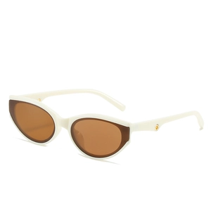 Fashionable ivory cat eye sunglasses with brown lenses and golden metal temple details
