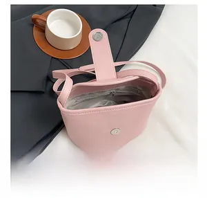 Detail view of pink soft leather bag interior with magnetic closure and inner zip pocket