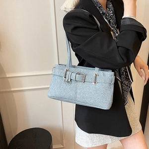 Retro light blue denim underarm bag with vintage buckle and slim strap detail
