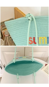 Detail of mint green hand-woven tote bag with colorful summer embroidery texture