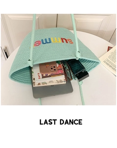 Detail of mint green woven tote bag interior showing ample space for iPad and essentials
