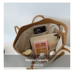 Interior view of large canvas tote bag showing spacious compartments and storage capacity