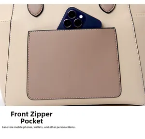 Close-up of front zipper pocket on beige tote bag showing smartphone storage detail