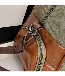 Close-up of military green canvas travel bag with high-density metal D-ring and hook