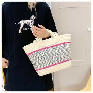 Close-up of contrast woven beach tote showing cotton rope texture and pink stripes detail