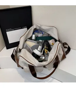 Spacious interior of beige canvas travel bag showing organized compartments and items