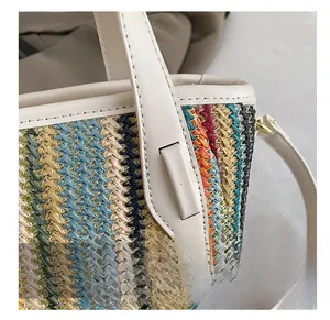 Detail showing colorful woven stripes and stitching on the faux leather handle