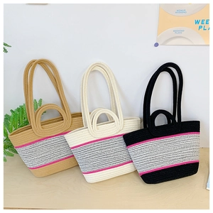 Detail of woven tote bags with colorful stripes and dual handles in three color options