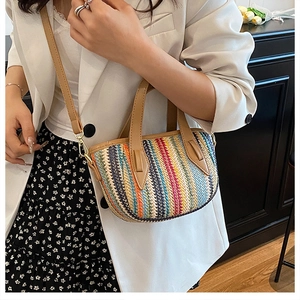 Detail of colorful woven shoulder bag with striped texture and brown leather strap