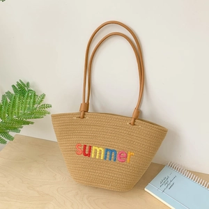 Handwoven khaki tote bag with colorful summer embroidery and slim brown leather handles